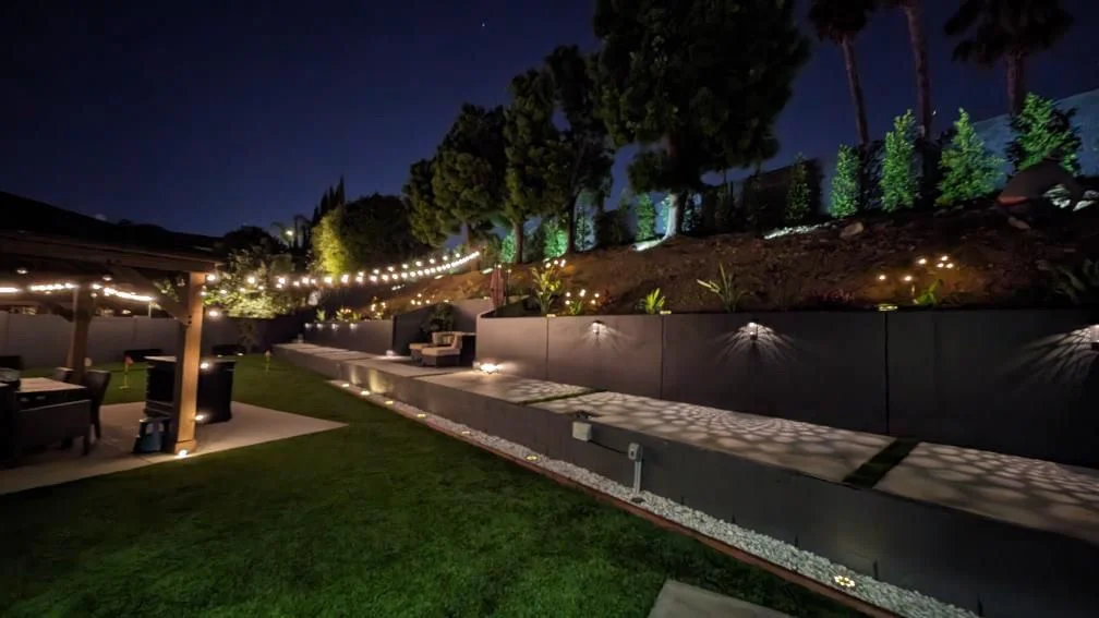 Landscaping and hardscaping installation with patio and retaining walls